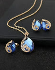 Blue Crystal Necklace + Earring Set in Blue Crystal in Gold